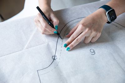 Verge reporter, Mia Sato works on a dress she is making from a vintage pattern at her makeshift sewing station - her dining room table - at her home in Brooklyn, NY. on June 9th, 2022